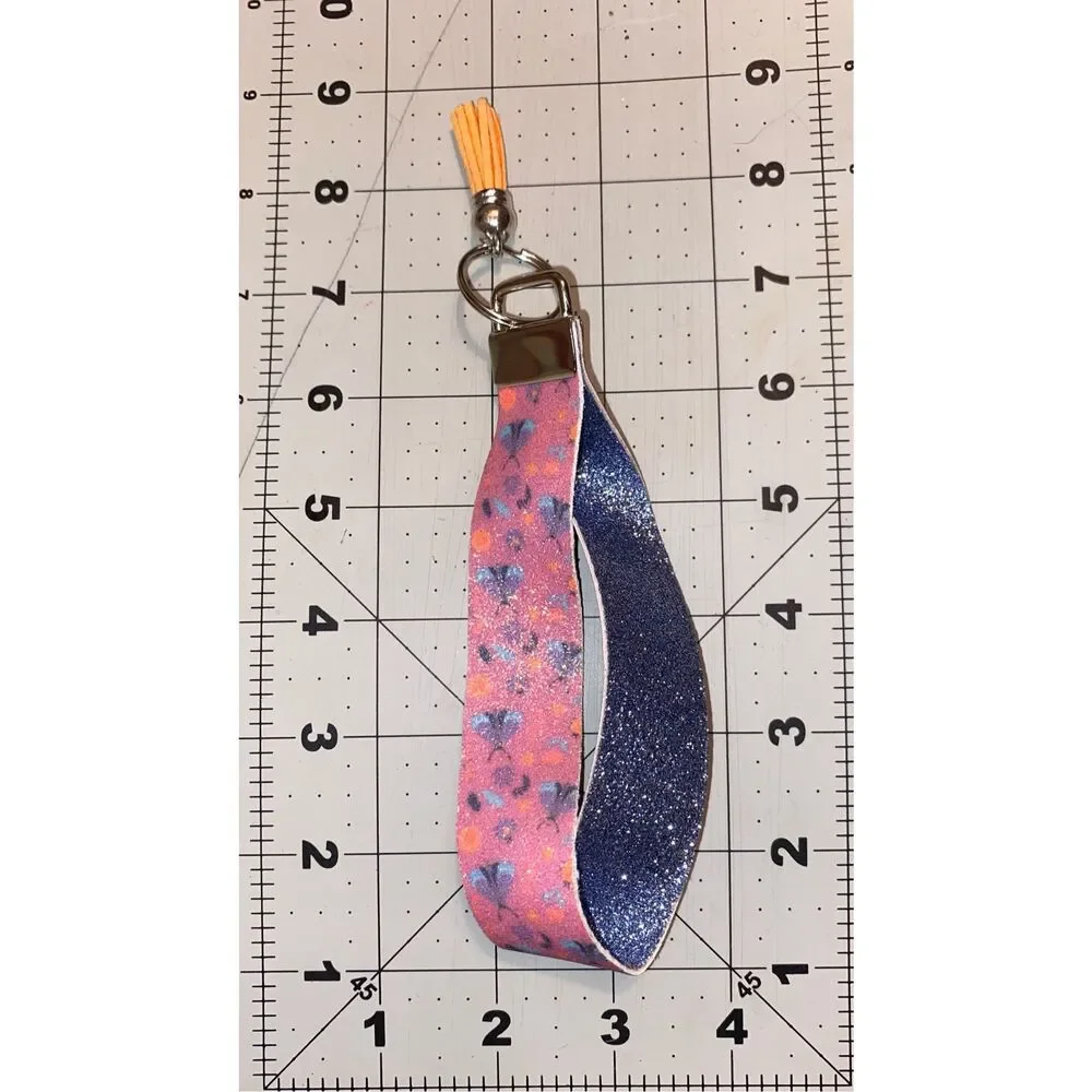 ☀️3/$9☀️ Glitter Butterfly and Flower Faux Leather Keychain with Orange Tassel